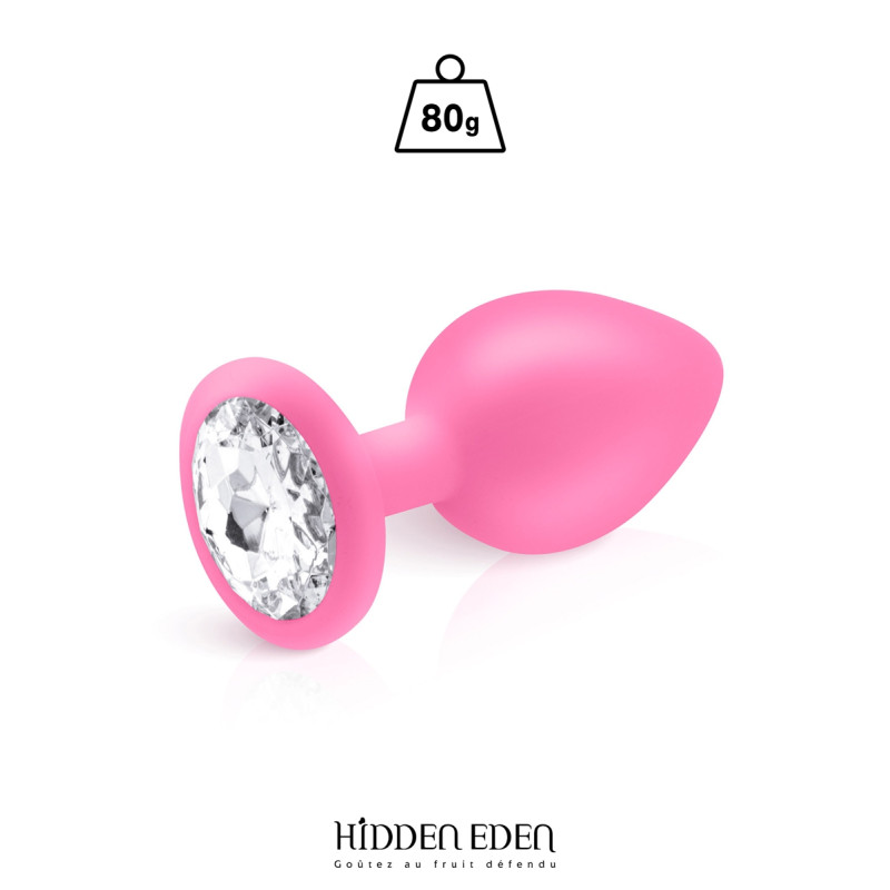 Plug bijou silicone rose L Hidden Eden posé sur fond blanc, strass transparent en évidence